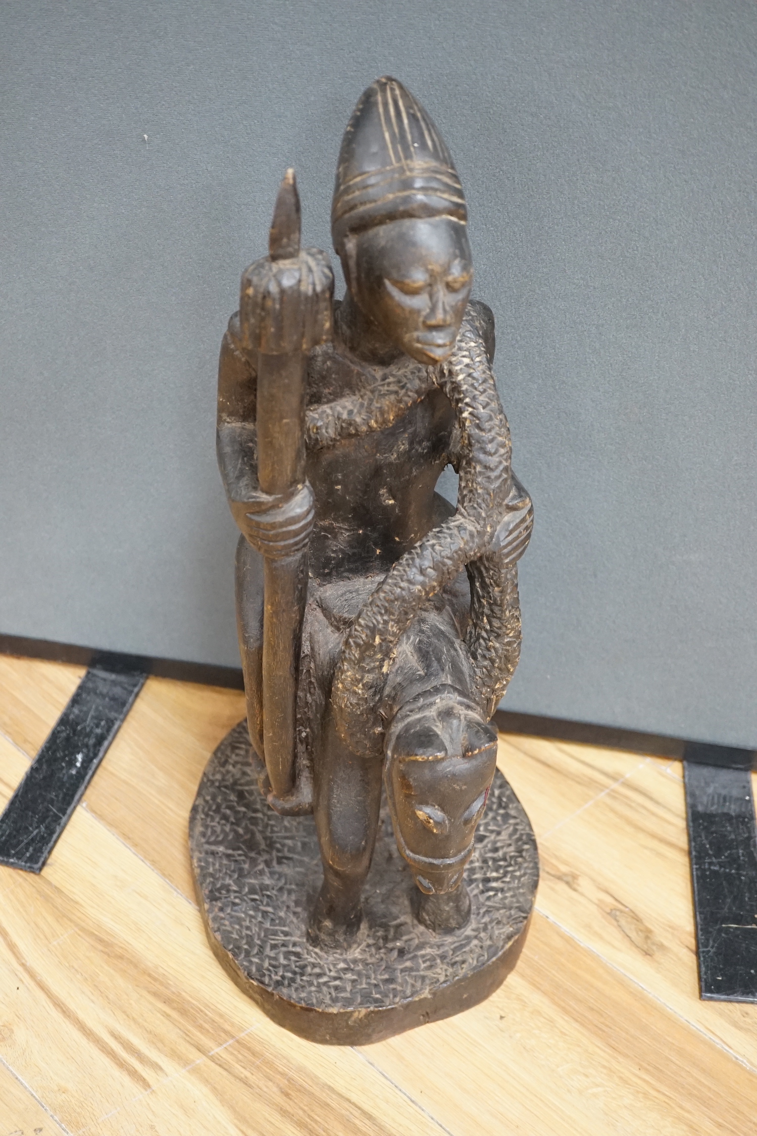 A West African tribal figure of a warrior on horseback, probably Dogon, 57cm high